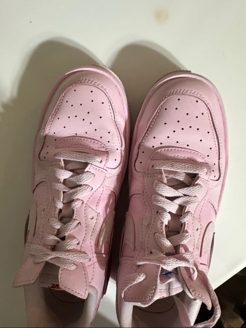 Nike Women’s Pink Low-Top Sneakers with Red Accent
